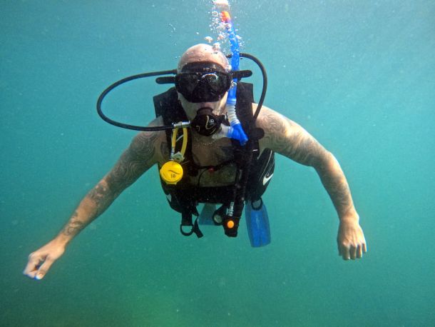 Diver floating in warm water